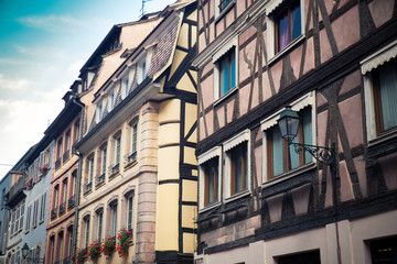 Fototapeta na wymiar Row of traditional old European buildings with half-timbered construction and window shutters from Strasbourg France.