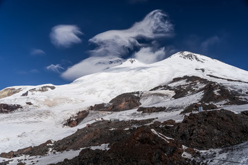 Fototapeta na wymiar View of Mount Elbrus. The highest point in Europe, sleeping volcano in the Caucasus Mountains. Ski resort, freeride