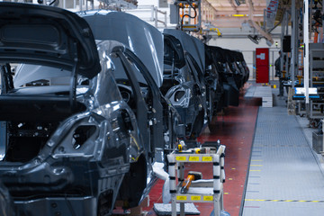 Movement of vehicles along the production line at the plant. Car Assembly shop. Car Assembly by parts