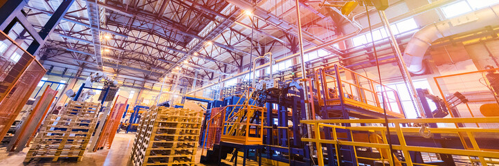 Fiberglass production industry equipment at manufacture background