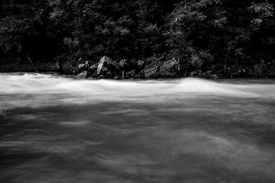 River flows, long exposure selective focus, black and white image taken at the Vidima river in Northern Bulgaria