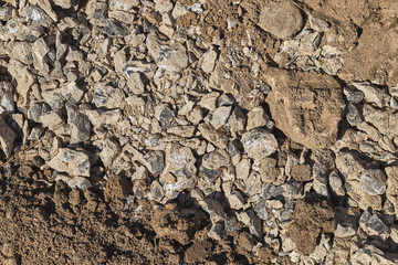 Mixed stone and ground background textured surface.