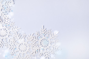Obraz premium Snowflakes on Blue Background Holiday Festive Christmas Winter Concept Copy Space Top View Minimal