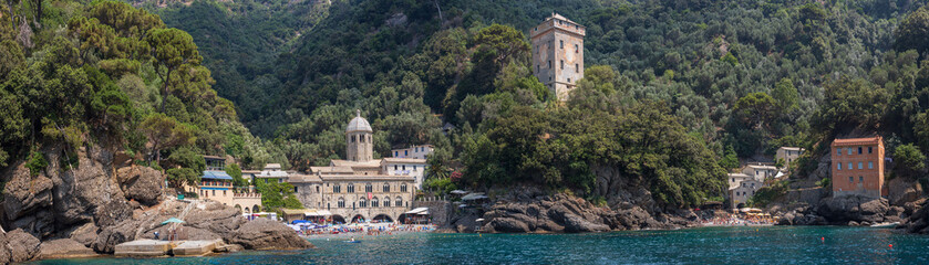 Fototapeta na wymiar Panoramic view of the stunning little town of San Fruttuoso near Camogli on the Ligurian coast, which can only be reached by ferry or by foot