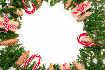 Fototapeta na wymiar Christmas composition. Round frame of fir branches and cones on white background. Flat lay, top view, copy space,