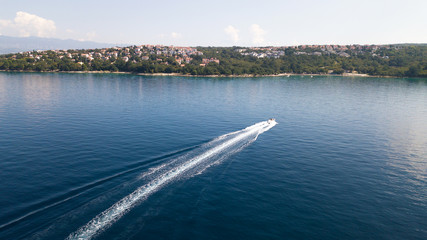 View from the air - powerboat sails to the sea