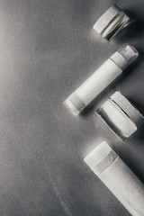 Naklejka premium view from above of beauty cream and lotion on silver