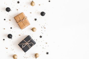 Christmas composition. Gifts, black and golden decorations on white background. Christmas, winter,...