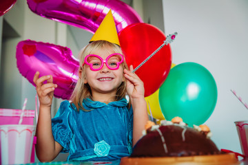 Obraz na płótnie Canvas happy cute little girl at birthday party