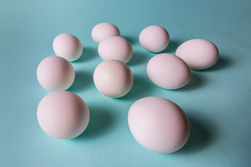 Minimalism style. eggs in a raw on classic blue background.