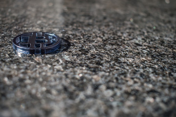 Plastic bit coin with marble background