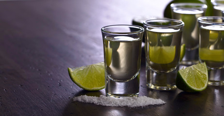 Tequila and lime slices.