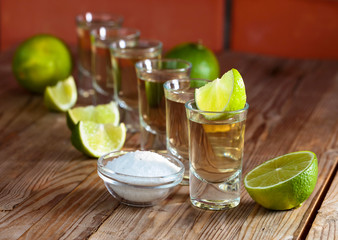 Tequila and lime slices.