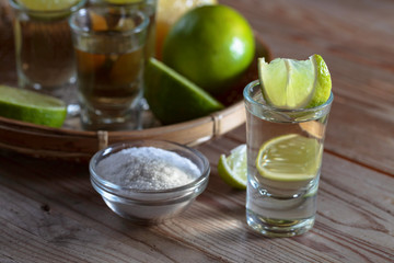 Tequila and lime slices.