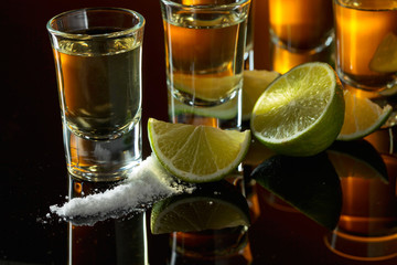 Tequila and lime slices.
