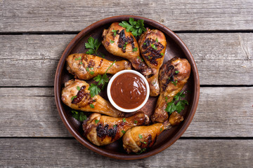 Grilled chicken legs with tomato sauce BBQ food background