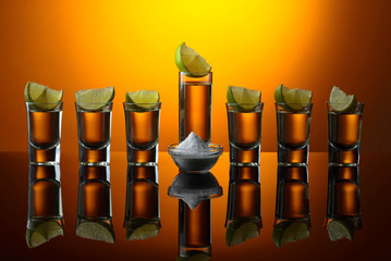 Tequila and lime slices.