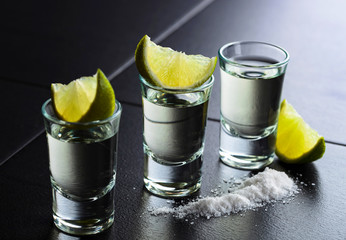 Tequila and lime slices.