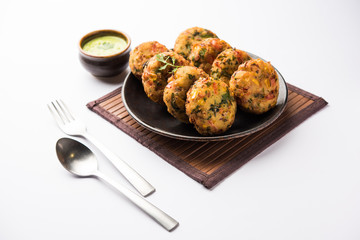 Crispy Corn Tikki, pakora/pakoda or pattice also known as cutlet. served with green chutney. Selective focus