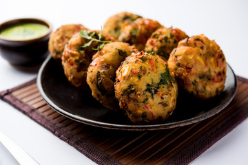Crispy Corn Tikki, pakora/pakoda or pattice also known as cutlet. served with green chutney. Selective focus