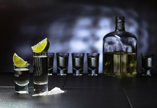 Tequila and lime slices.