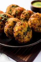 Crispy Corn Tikki, pakora/pakoda or pattice also known as cutlet. served with green chutney. Selective focus