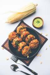 Crispy Corn Tikki, pakora/pakoda or pattice also known as cutlet. served with green chutney. Selective focus