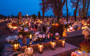 Candles Burning At a Cemetery During All Saints Day.  - Powered by Adobe