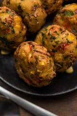 Crispy Corn Tikki, pakora/pakoda or pattice also known as cutlet. served with green chutney. Selective focus