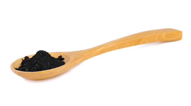 Activated charcoal powder isolated on white background