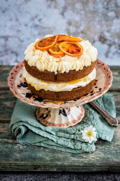 An orange pound cake with cream cheese and manuka honey