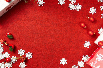 Christmas background. Red Christmas box on a red background. Greeting Christmas card.