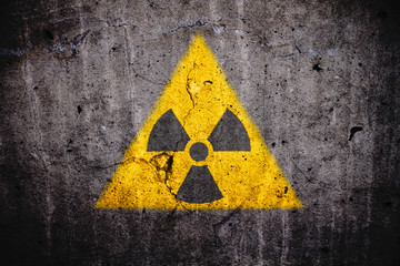 Radioactive (atomic nuclear ionizing radiation) danger warning symbol in triangular yellow shape...