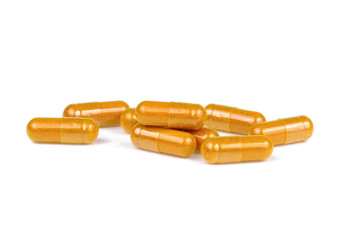 turmeric capsules on white background