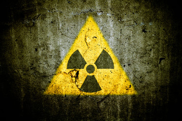 Radioactive (atomic nuclear ionizing radiation) danger warning symbol in triangular yellow shape...