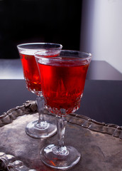 Two glasses with sea buckthorn drink on the table