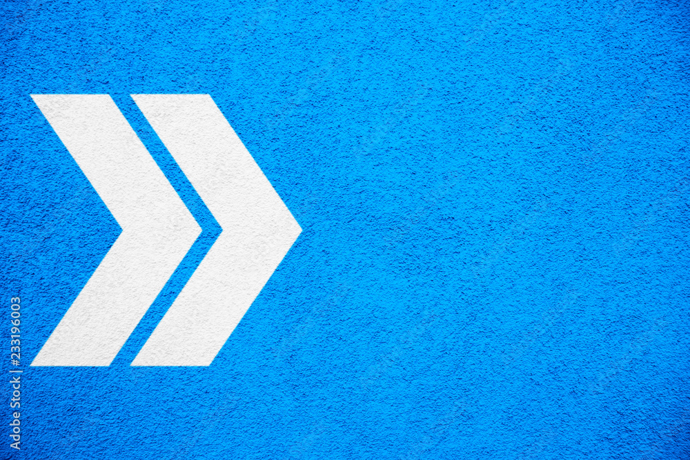 Poster white arrows signs pointing right direction over intense bright blue color stucco rough wall as an e
