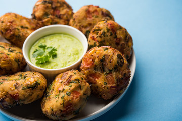 Crispy Corn Tikki, pakora/pakoda or pattice also known as cutlet. served with green chutney. Selective focus