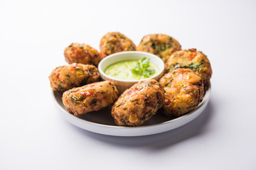 Crispy Corn Tikki, pakora/pakoda or pattice also known as cutlet. served with green chutney. Selective focus