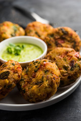 Crispy Corn Tikki, pakora/pakoda or pattice also known as cutlet. served with green chutney. Selective focus