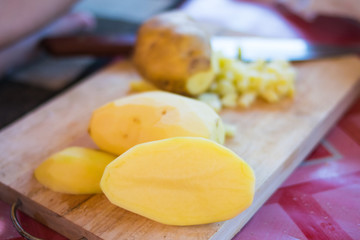 fresh potato slice on wooden board