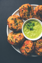 Crispy Corn Tikki, pakora/pakoda or pattice also known as cutlet. served with green chutney. Selective focus