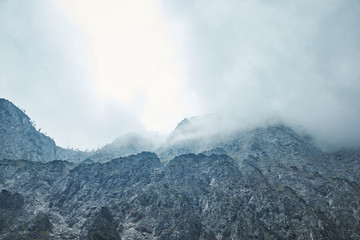Dramatic Mountain Range With Stormy Clouds In The Sky - Blue Color