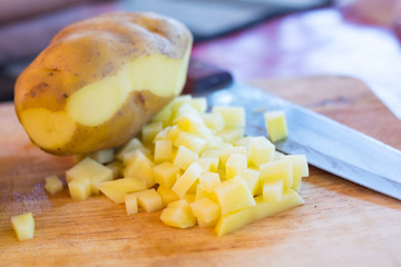 fresh potato slice on wooden board
