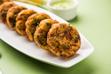Crispy Corn Tikki, pakora/pakoda or pattice also known as cutlet. served with green chutney. Selective focus