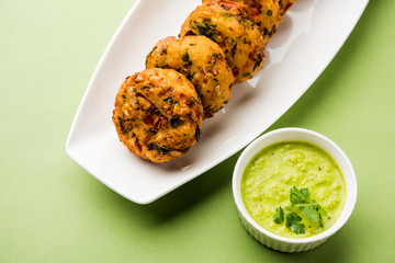 Crispy Corn Tikki, pakora/pakoda or pattice also known as cutlet. served with green chutney. Selective focus