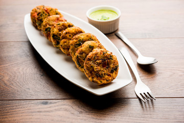 Crispy Corn Tikki, pakora/pakoda or pattice also known as cutlet. served with green chutney. Selective focus
