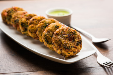 Crispy Corn Tikki, pakora/pakoda or pattice also known as cutlet. served with green chutney. Selective focus