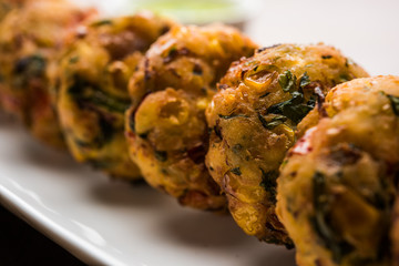 Crispy Corn Tikki, pakora/pakoda or pattice also known as cutlet. served with green chutney. Selective focus