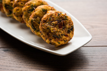 Crispy Corn Tikki, pakora/pakoda or pattice also known as cutlet. served with green chutney. Selective focus